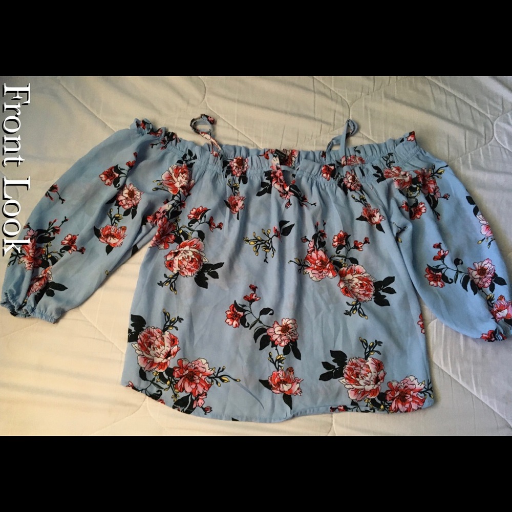 A blue floral shirt size XL